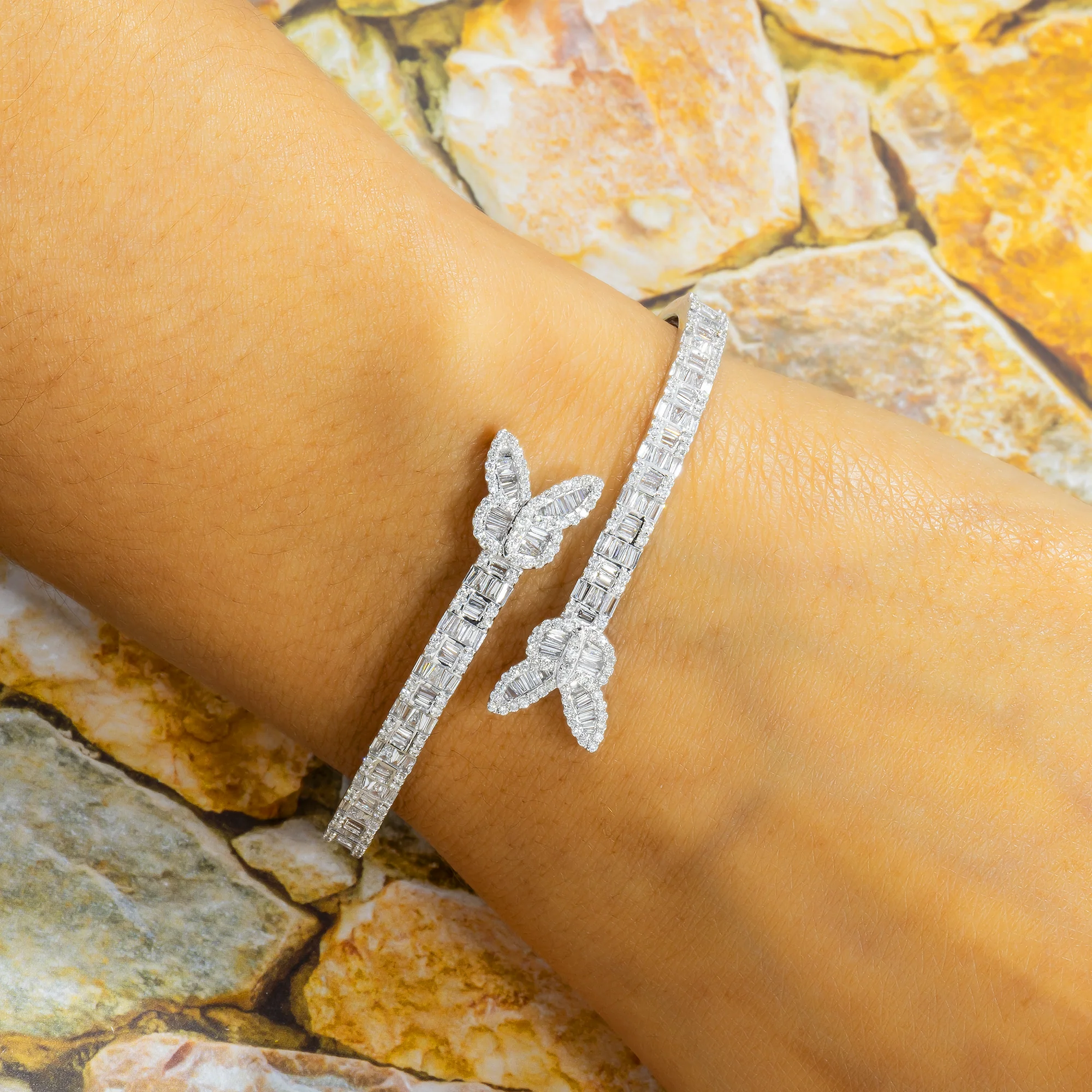 10K GOLD ROUND AND BAGUETTE DIAMOND BUTTERFLY BYPASS BANGLE 2.48 CT - Image 2